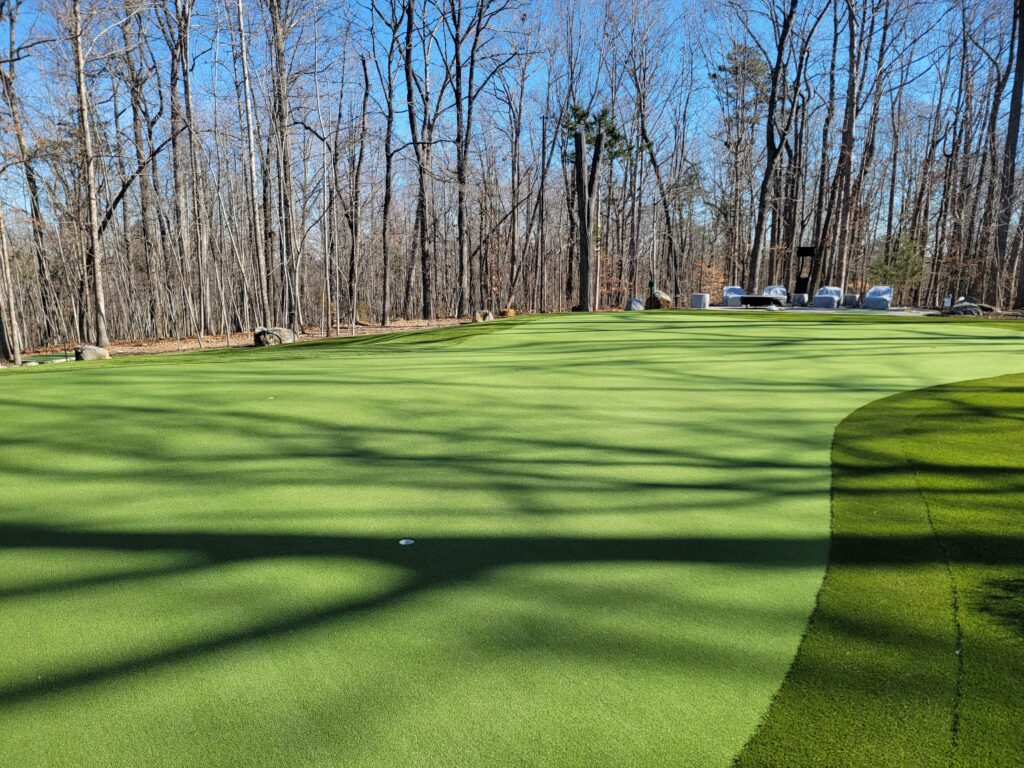 Synthetic turf cleaning being performed on artificial grass surface